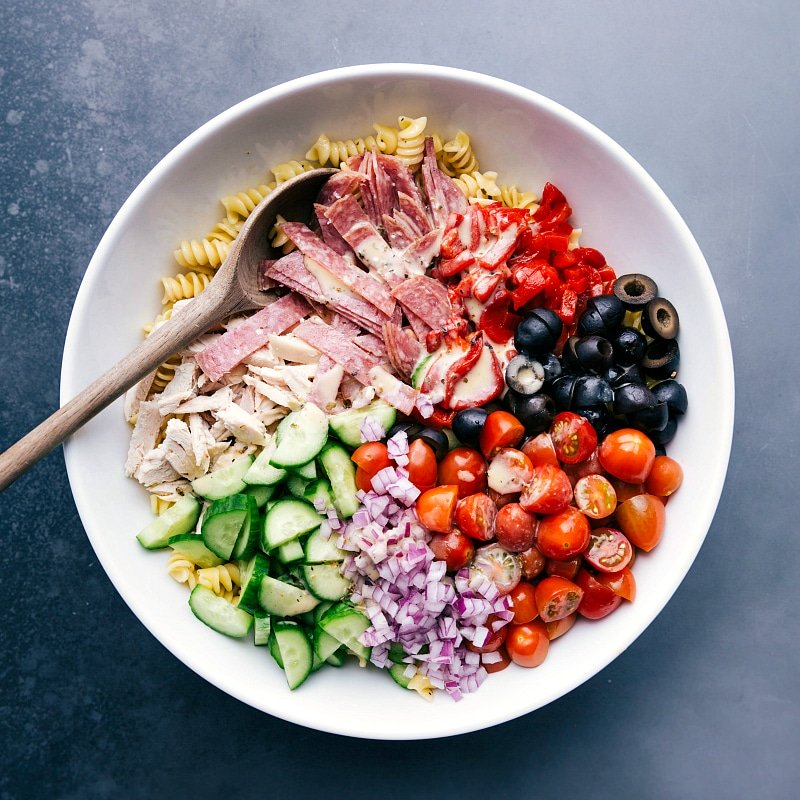 All the ingredients for the italian pasta salad recipe grouped together, showcasing the variety and freshness.