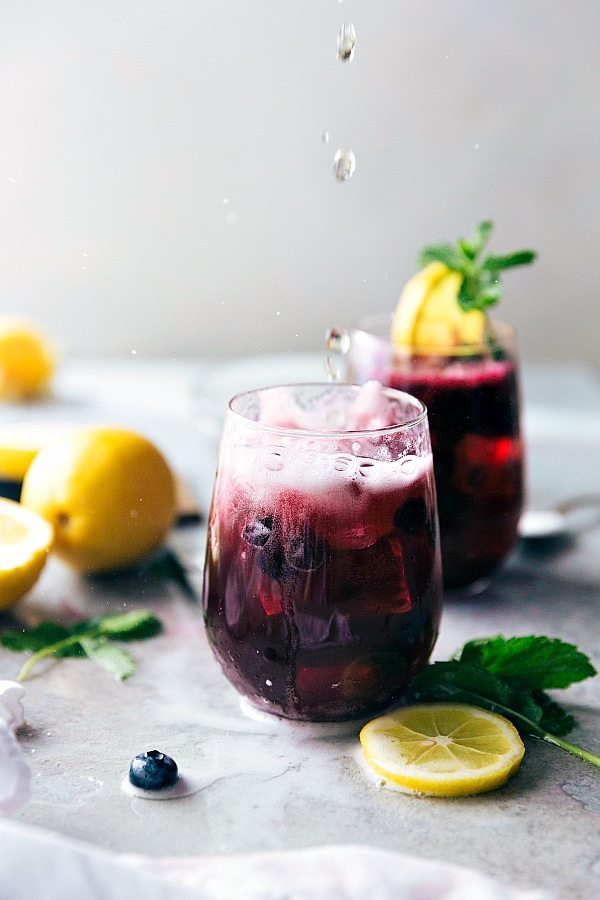 Easy and delicious sparkling blueberry lemonade. The perfect cool down summer drink! Recipe via chelseasmessyapron.com