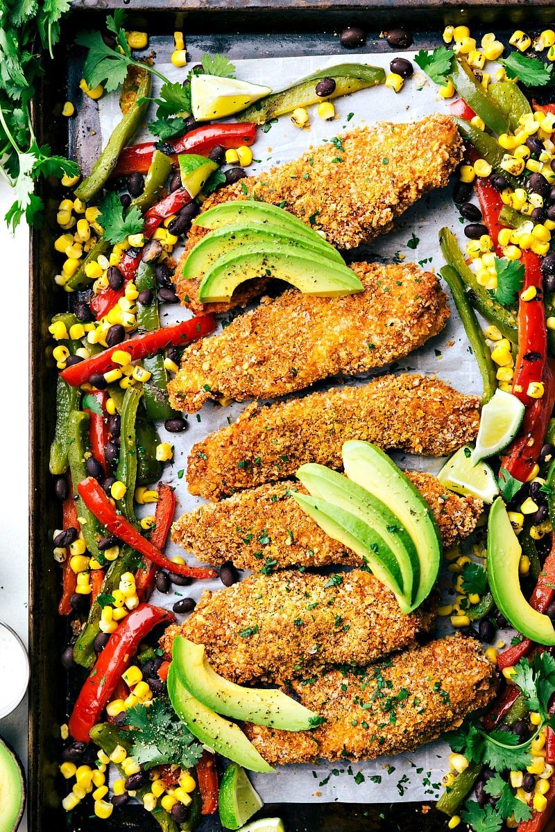 Mexican tortilla crusted chicken baked on one pan with plenty of veggies! Via chelseasmessyapron.com