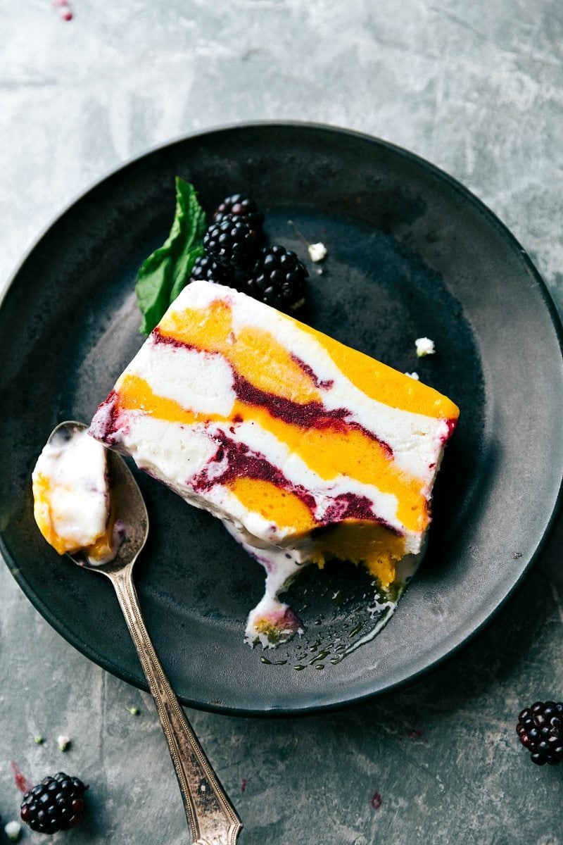 Only FIVE ingredients and a bread pan needed to make this impressive looking and beautiful dessert consisting of sorbet, frozen fruit, and vanilla bean ice cream. A show-stopping SORBET SLICE dessert that couldn't be easier to make! Via chelseasmessyapron.com