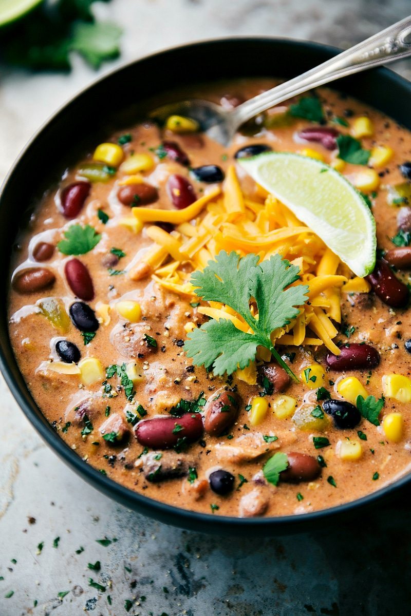 Dump it and forget about it crockpot creamy chicken taco chili with chicken, lots of beans and veggies, and plenty of good spice! Recipe via chelseasmessyapron.com