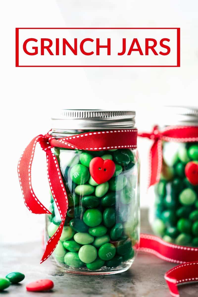 Image of the grinch jars that go along with these christmas mason jar gift ideas