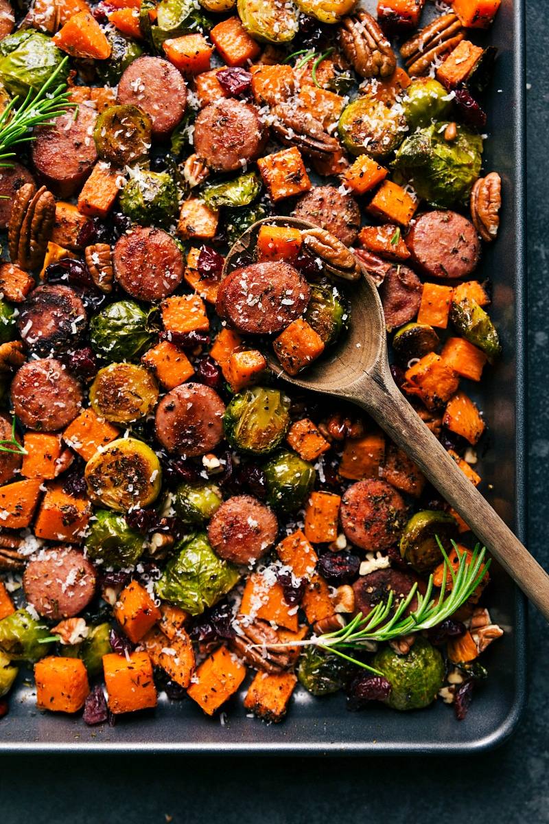 Tray of harvest vegetables and sausage, cooked and seasoned to perfection, ready to serve.