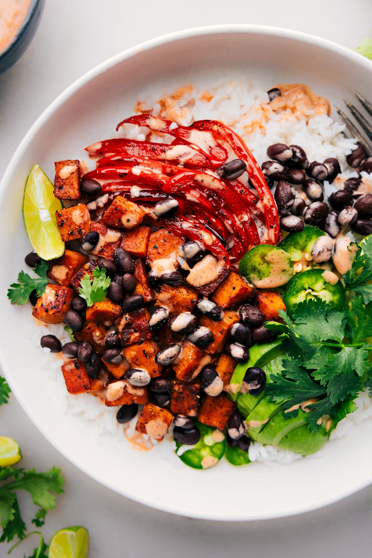 Sweet Potato and Black Bean Burrito Bowls, colorfully assembled and ready to be enjoyed.