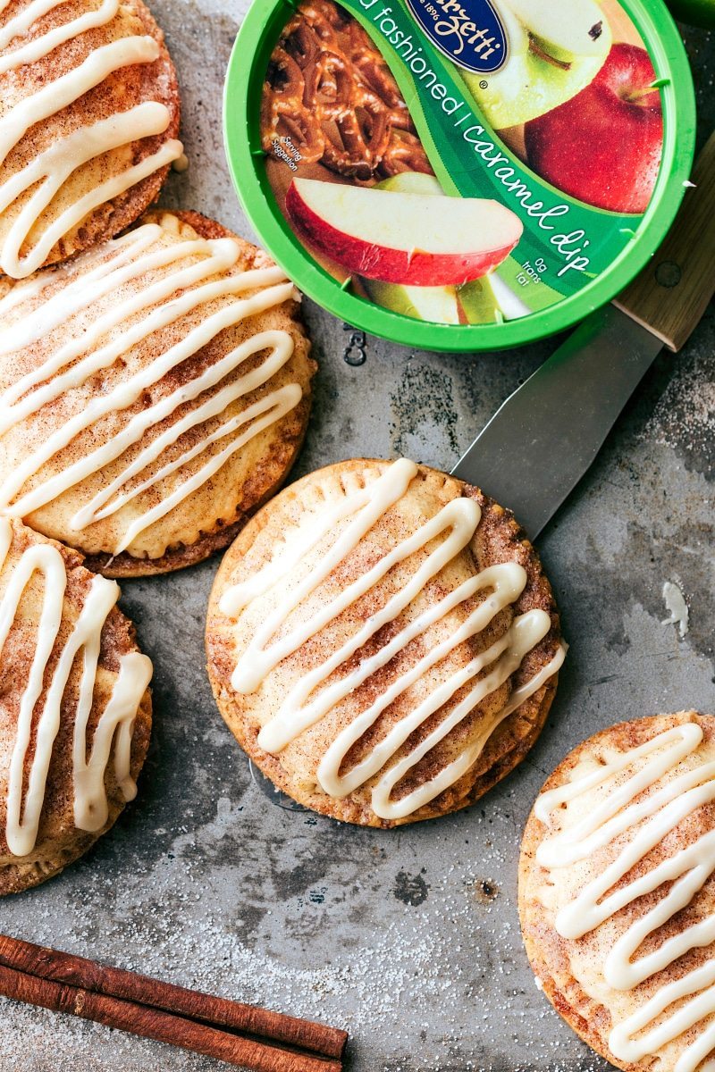 Delicious and flakey hand apple pies made for dipping in a thick, rich, and creamy caramel sauce! via chelseasmessyapron.com