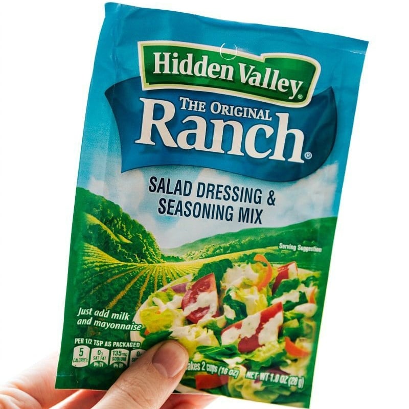 The ranch salad dressing and seasoning mix used in the recipe.