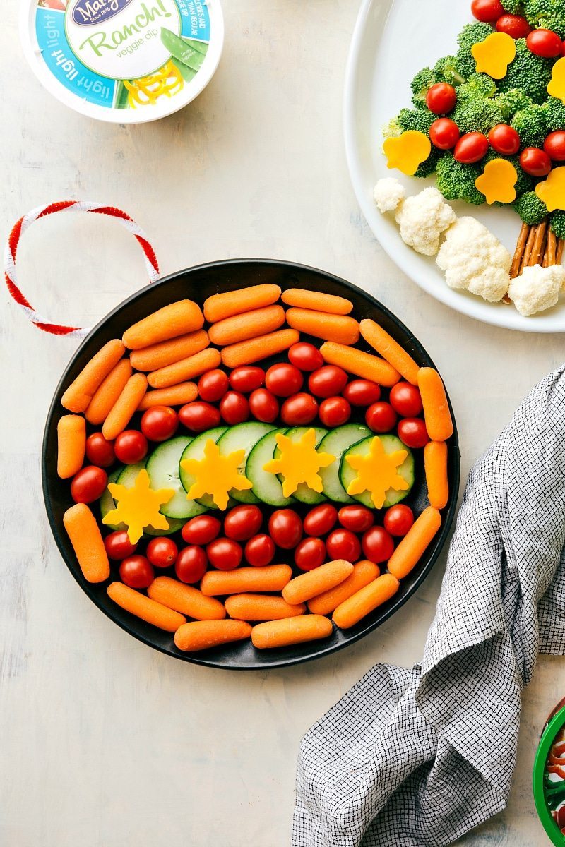 EASY Holiday Veggie Platters!! Two easy ways to dress up your holiday veggie platters! A Christmas Tree and an Ornament made out of veggies with delicious dips! Platters from chelseasmessyapron.com