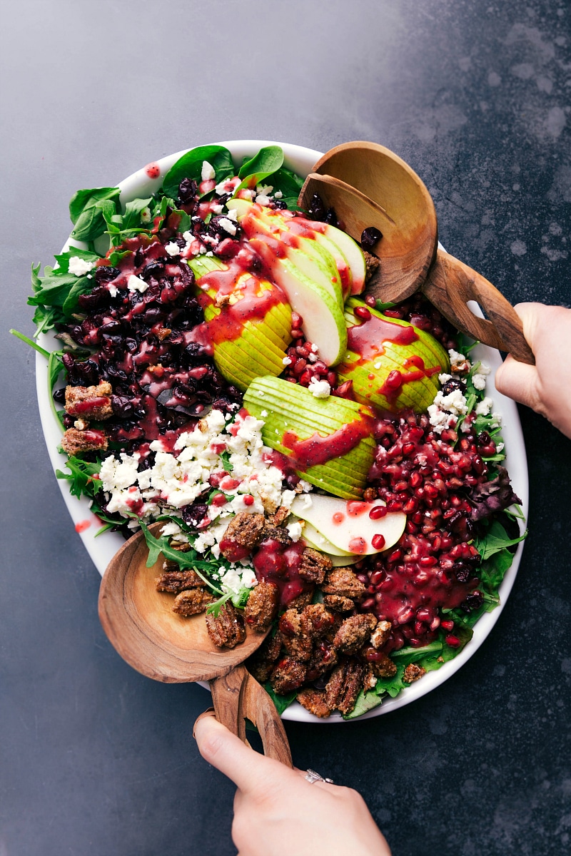 Overhead image of Pear Salad with dressing drizzled over it.