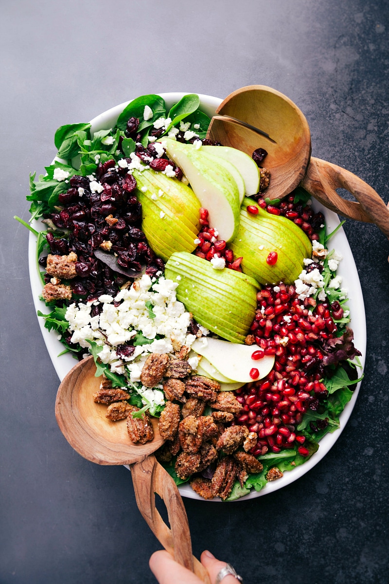 Pear salad recipe displayed in compartments, with each ingredient neatly arranged in its own spot.