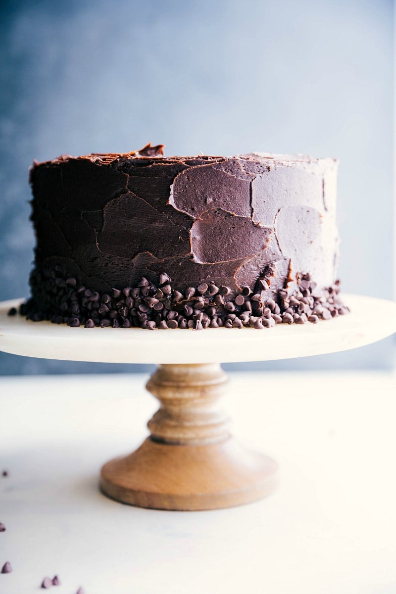 A finished and gorgeous banana chocolate chip cake on a cake stand.