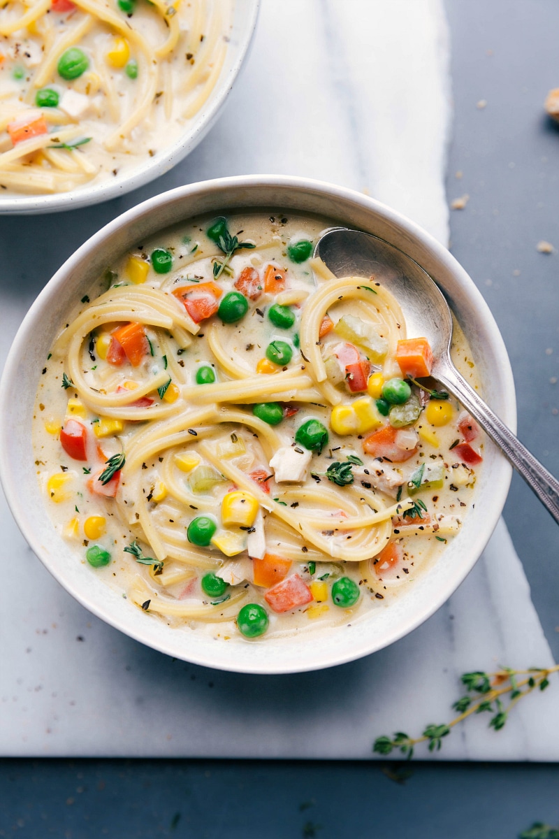Flavorful Creamy Chicken Noodle Soup with Vegetables and Seasonings Creamy chicken noodle soup, full of delicious vegetables and seasonings.