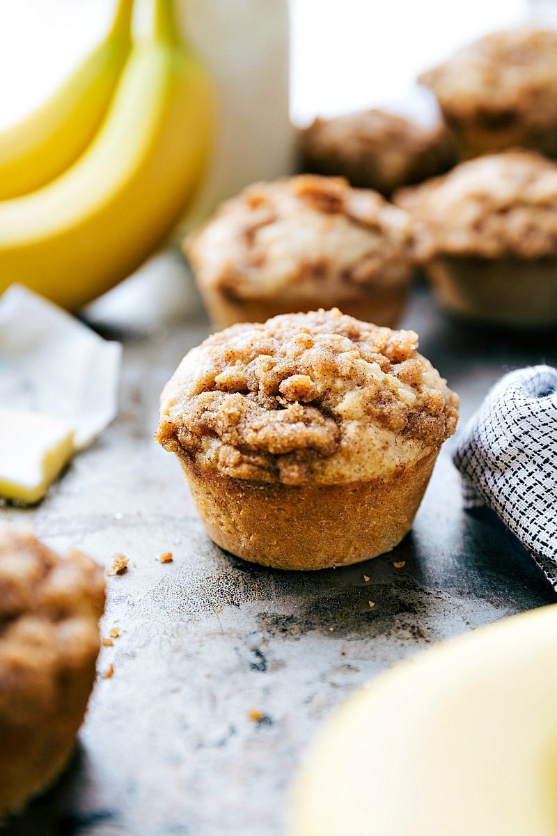 Banana crumb muffins with a delicious crumble topping, baked to perfection.
