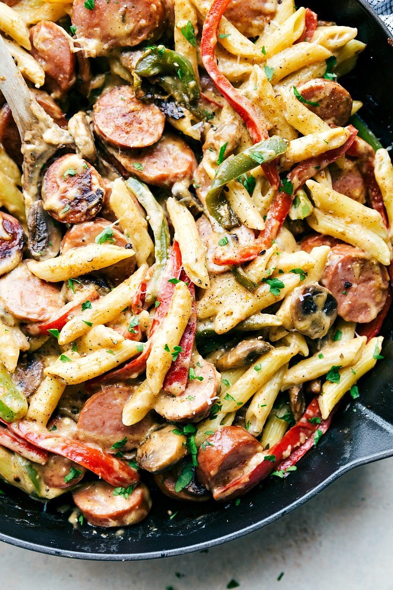 EASY ONE POT Creamy cajun sausage pasta and veggies made healthier for you! Recipe from chelseasmessyapron.com