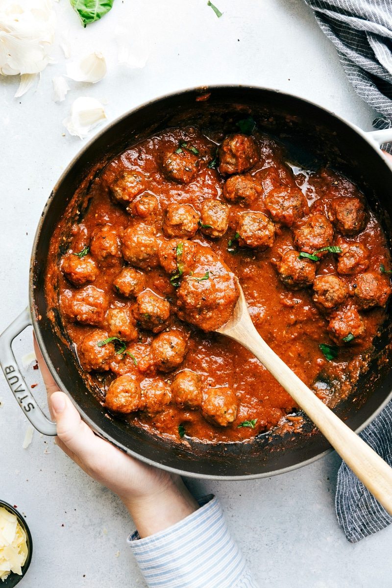 The BEST EVER meatballs! Mozzarella stuffed and served in the most delicious marinara. I Recipe from chelseasmessyapron.com