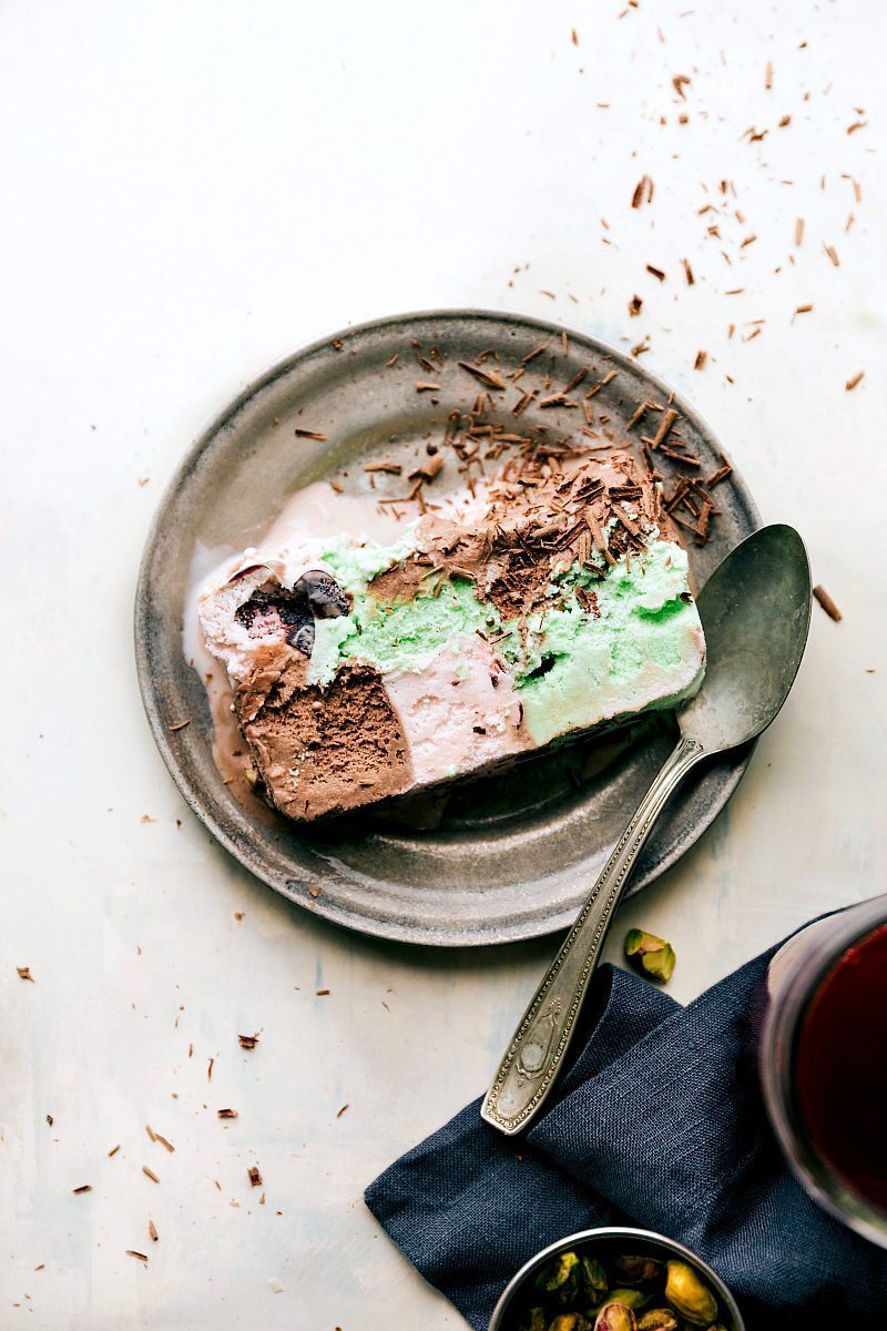 PUMONI ICE CREAM TERRINE! Layer 3 flavors of ice cream in a bread pan and you get this amazing dessert! Plus an easy tart cherry sauce! via chelseasmessyapron.com