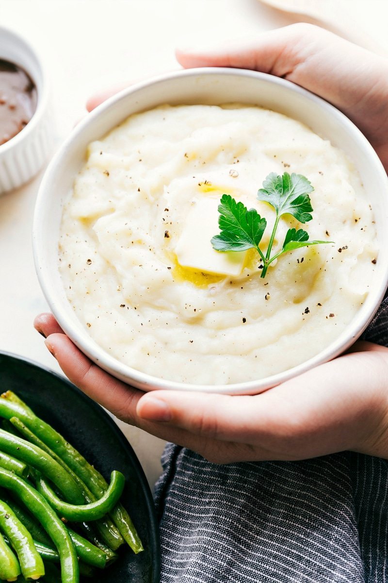 Overhead image of the mashed potatoes that go on the sheet pan with the mini meatloaf