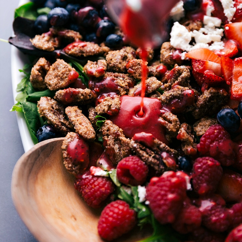 Image of the dressing being poured on the salad.