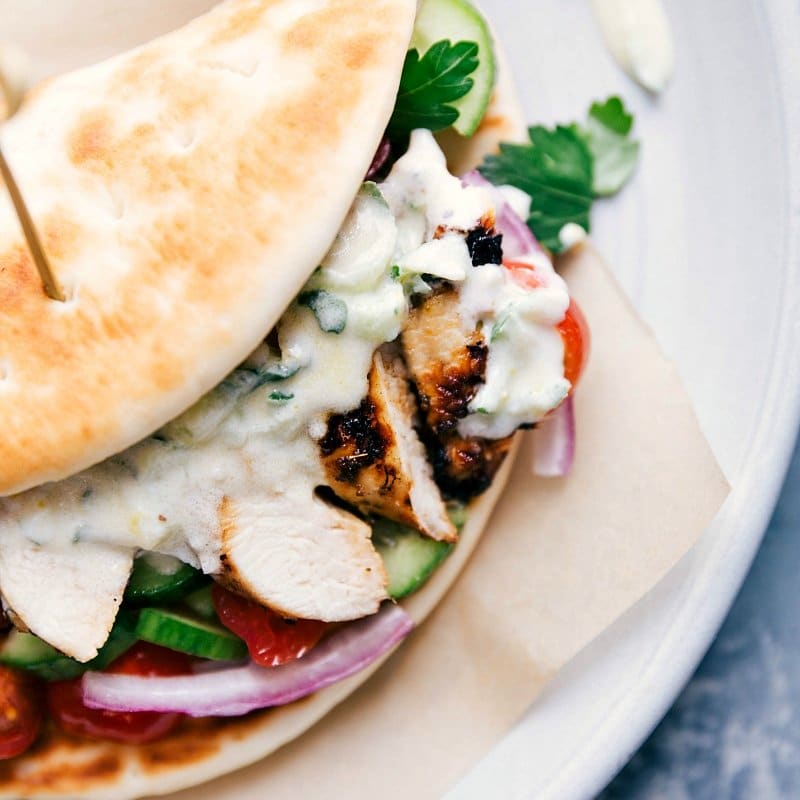 Up-close overhead image of Chicken Gyros stuffed with all the ingredients and ready to be eaten.