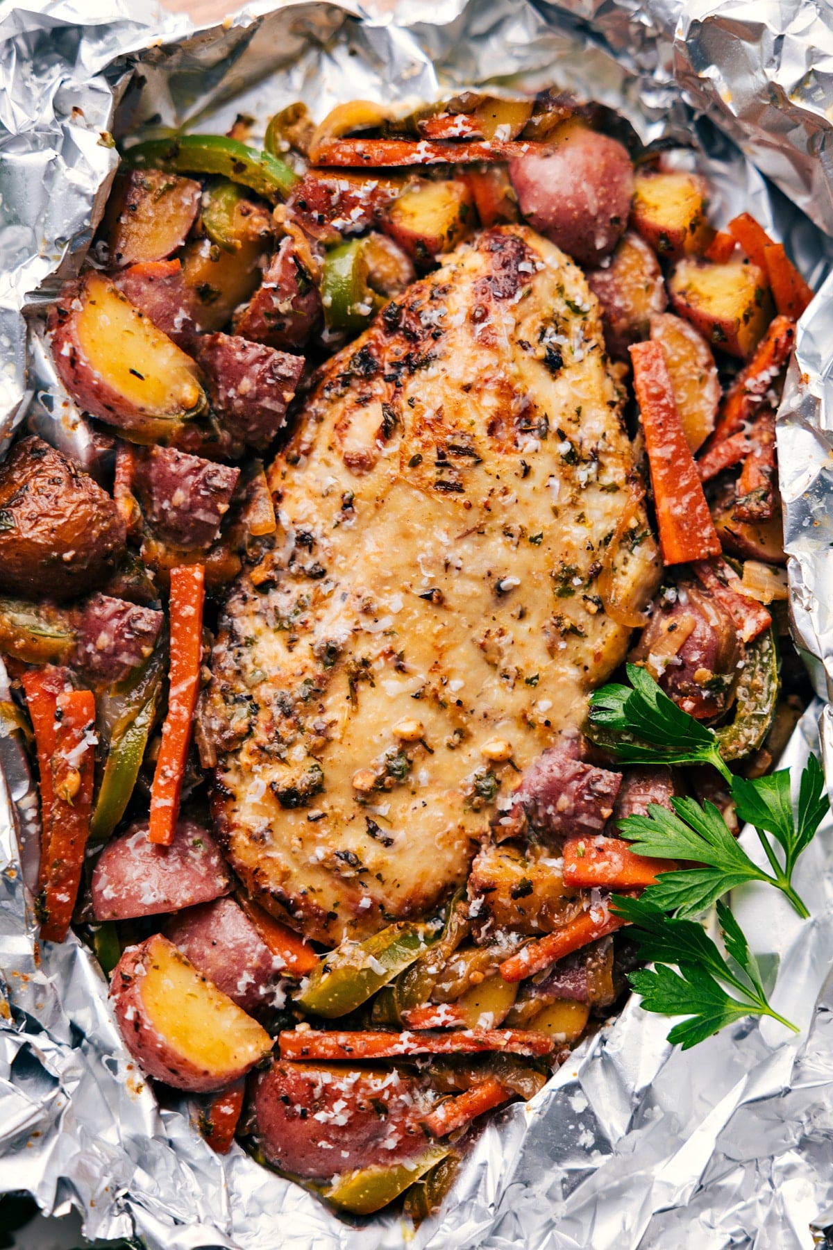 Italian Chicken And Veggies Italian recipes chicken and veggies foil pack with seasoned chicken and vegetables.