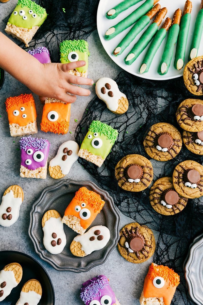 3-ingredients to make these adorable (and delicious) Halloween treats -- Monster Rice Krispies Treats, Peanut Butter Spider Cookies, Nutter Butter Ghosts, and Witch Finger Pretzels. chelseasmessyapron.com