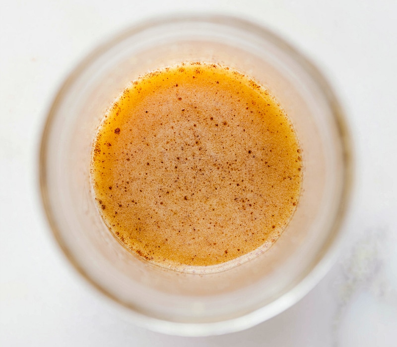 Image of the finished apple cider vinaigrette dressing in a mason jar.