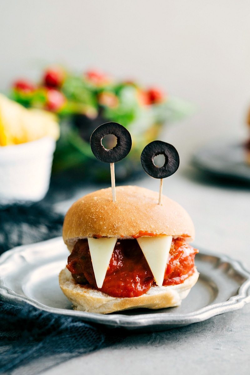 Image of the Monster Meatball Sliders with olive eyes and cheese teeth that go along with these halloween appetizers easy to make