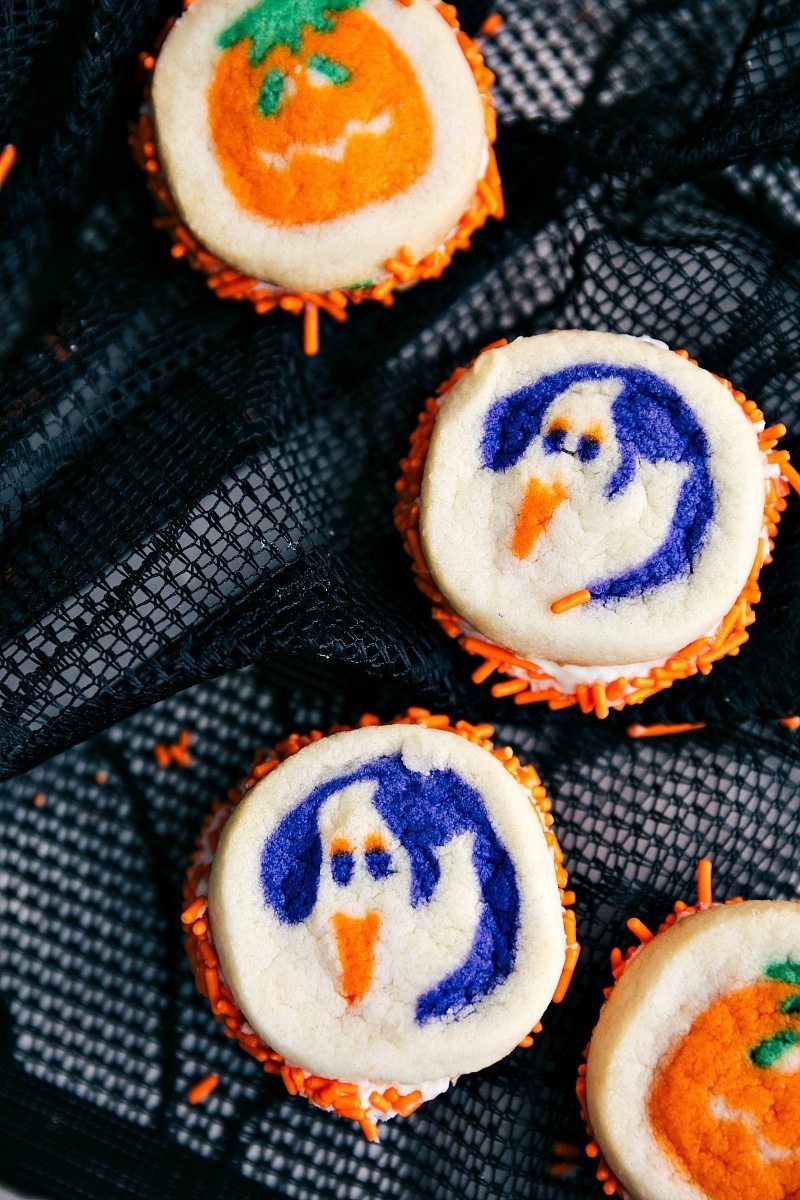 Image of 4 double sided halloween cookies with pumpkins and ghosts on them. These go along nicely with the other halloween treat ideas