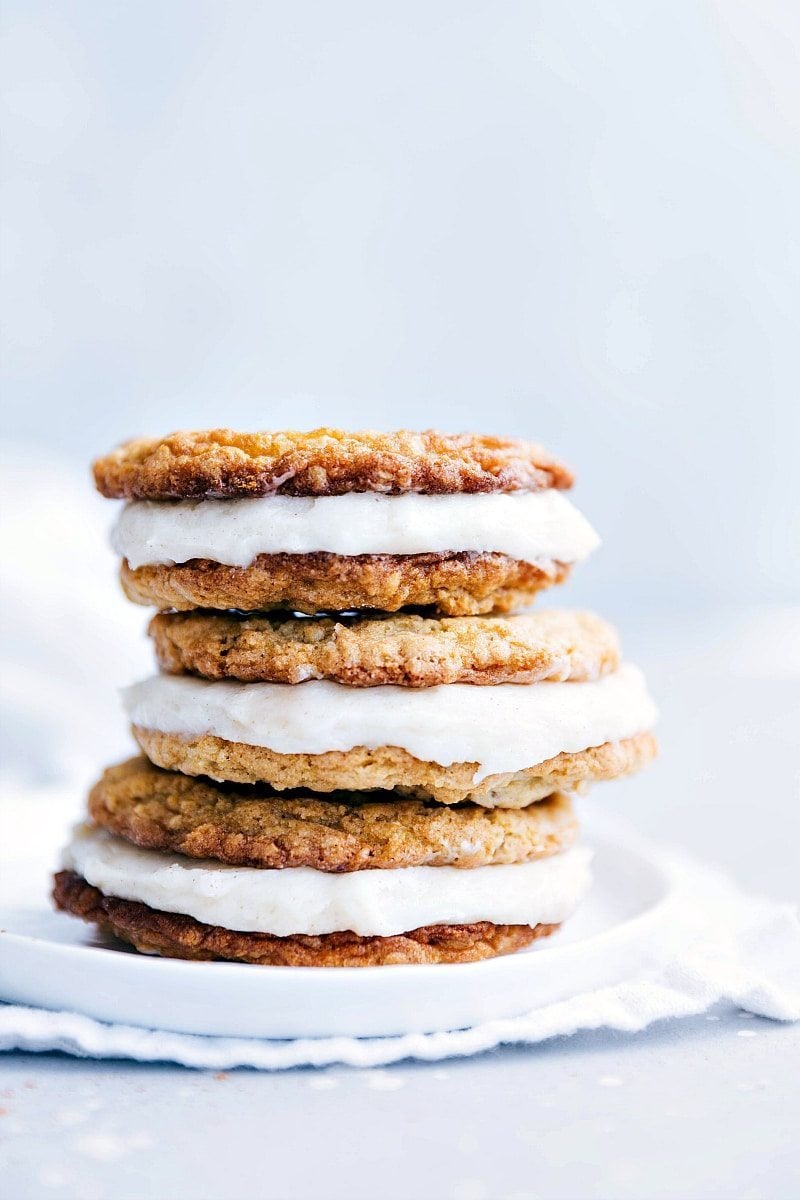 Three Oatmeal Creme Pie cookies stacked on a plate