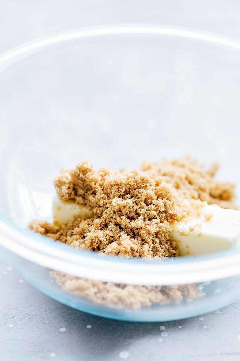 A bowl with brown sugar and butter ready to be mixed