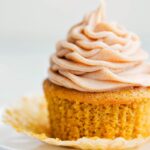Ready to eat delicious pumpkin cupcake with a cinnamon cream cheese frosting.