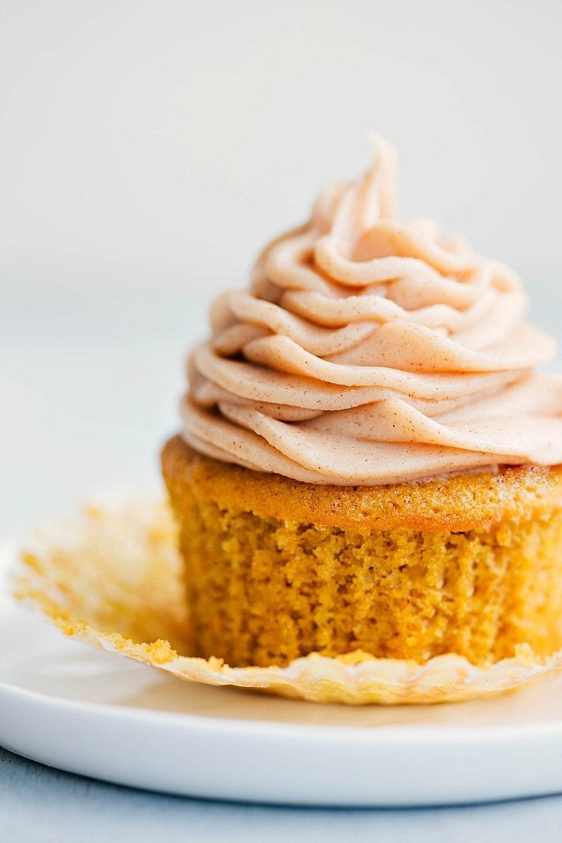 Image of the ready-to-eat Pumpkin Cupcake with cinnamon-cream cheese frosting on it.