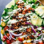 Vibrant and colorful turkey taco salad, fully dressed and ready to serve.
