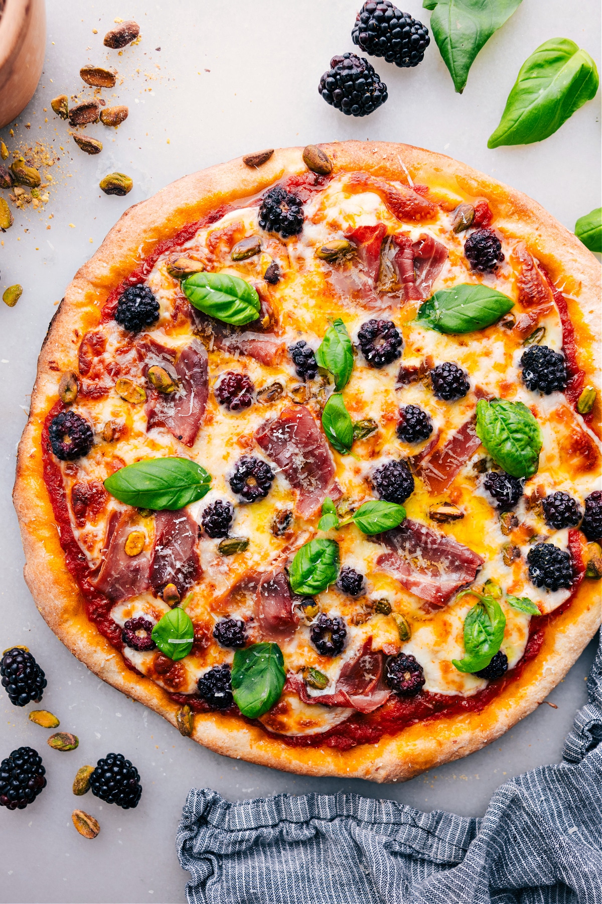 The Best Blackberry Basil Pizza Recipe Freshly baked Blackberry Basil Pizza, topped with vibrant fresh basil.