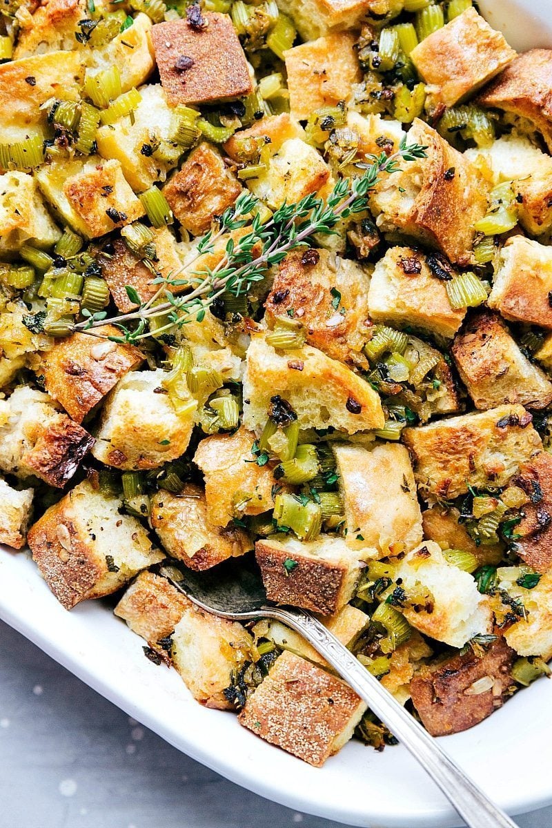 Up-close photo of the finished Thanksgiving Dressing with a spoon shoveling some out!