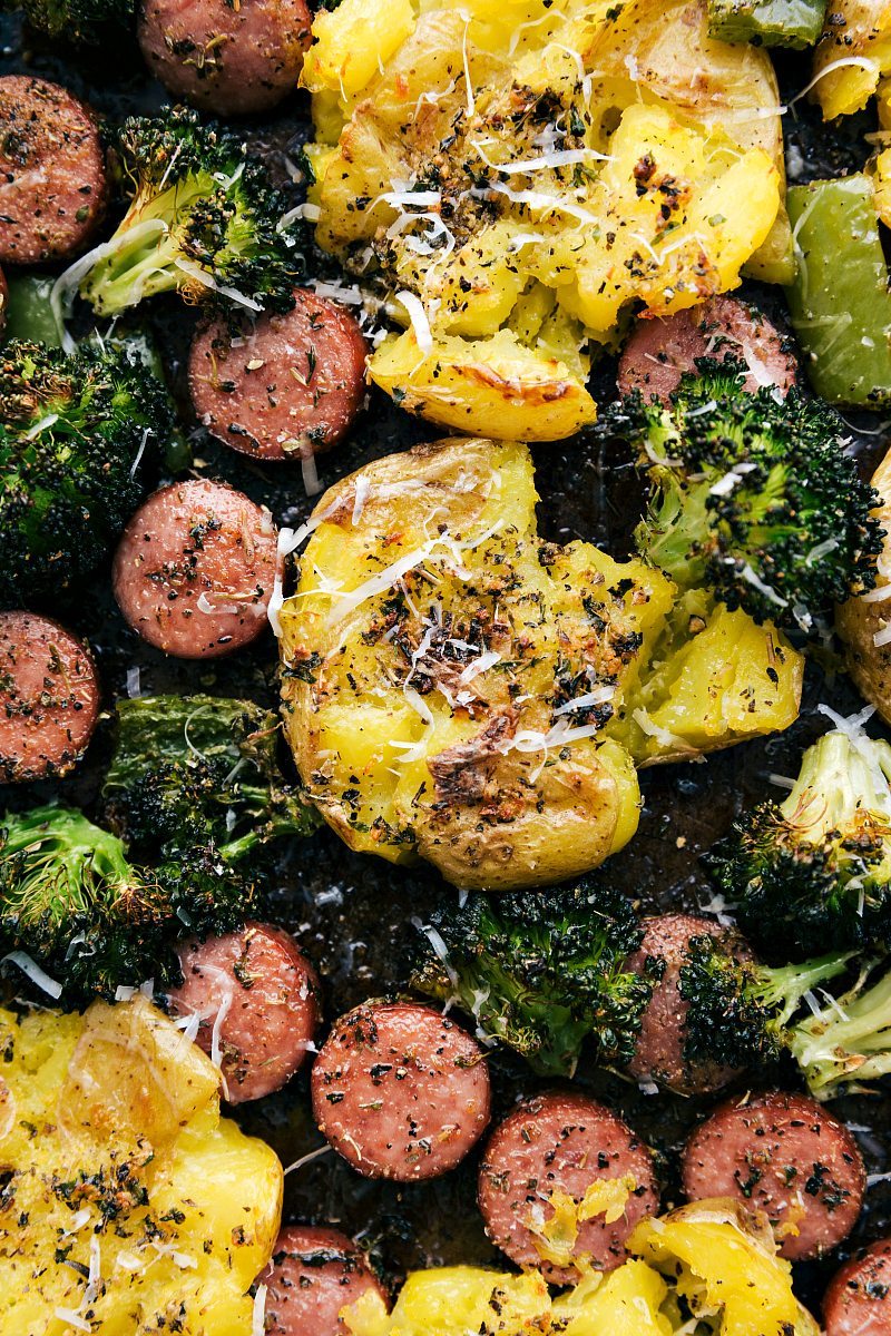 Up close photo of smashed potatoes, sausage, and veggies