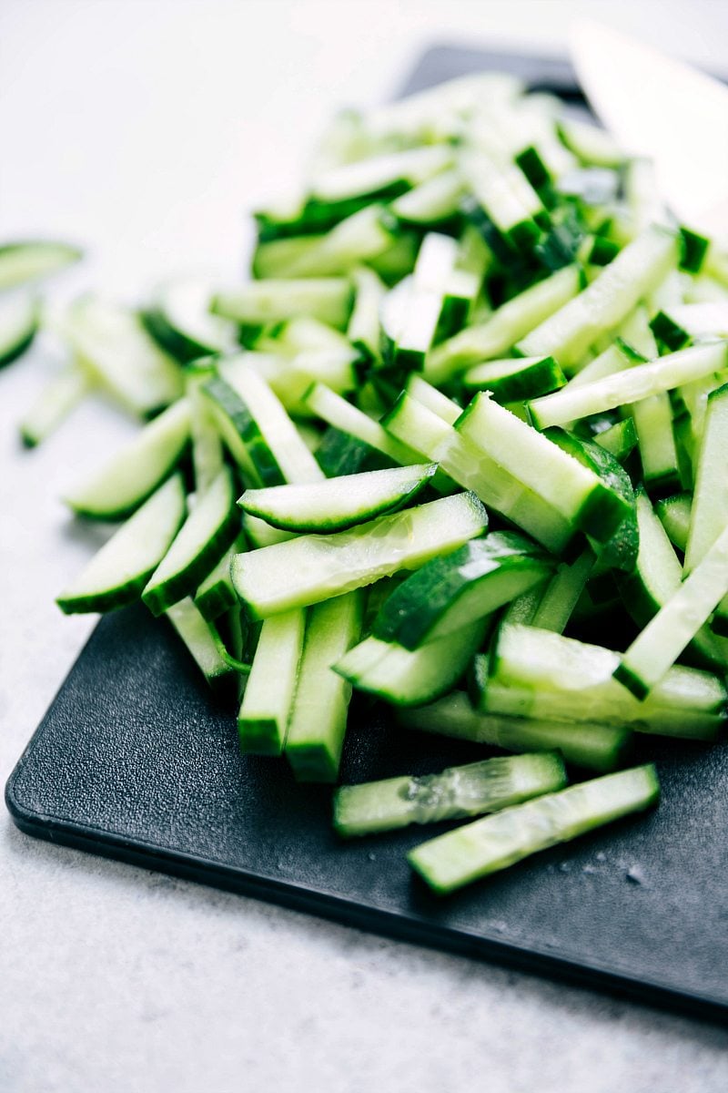 Cucumbers sliced to top Banh Mi Bowls.