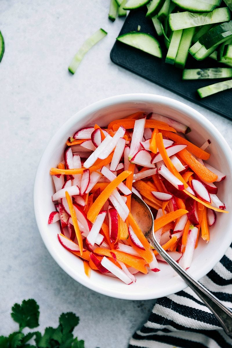 Overhead close up picture of pickled radish and carrot mix for banh mi sandwich