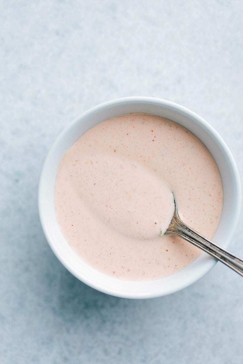 Up close photo of sriracha lime mayo for banh mi bowls