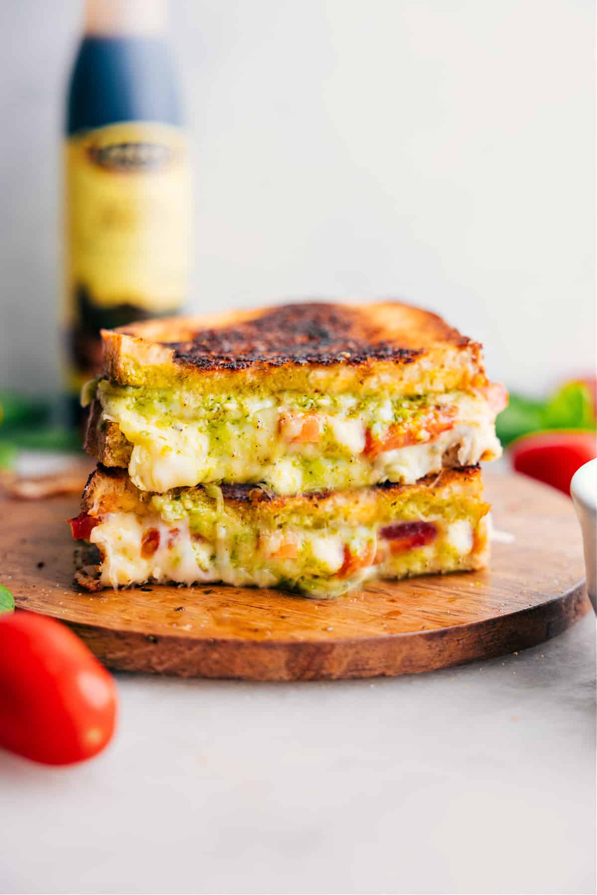 Caprese Grilled Cheese Recipe Caprese Grilled Cheese stacked on top of each other showing the cheesy center.