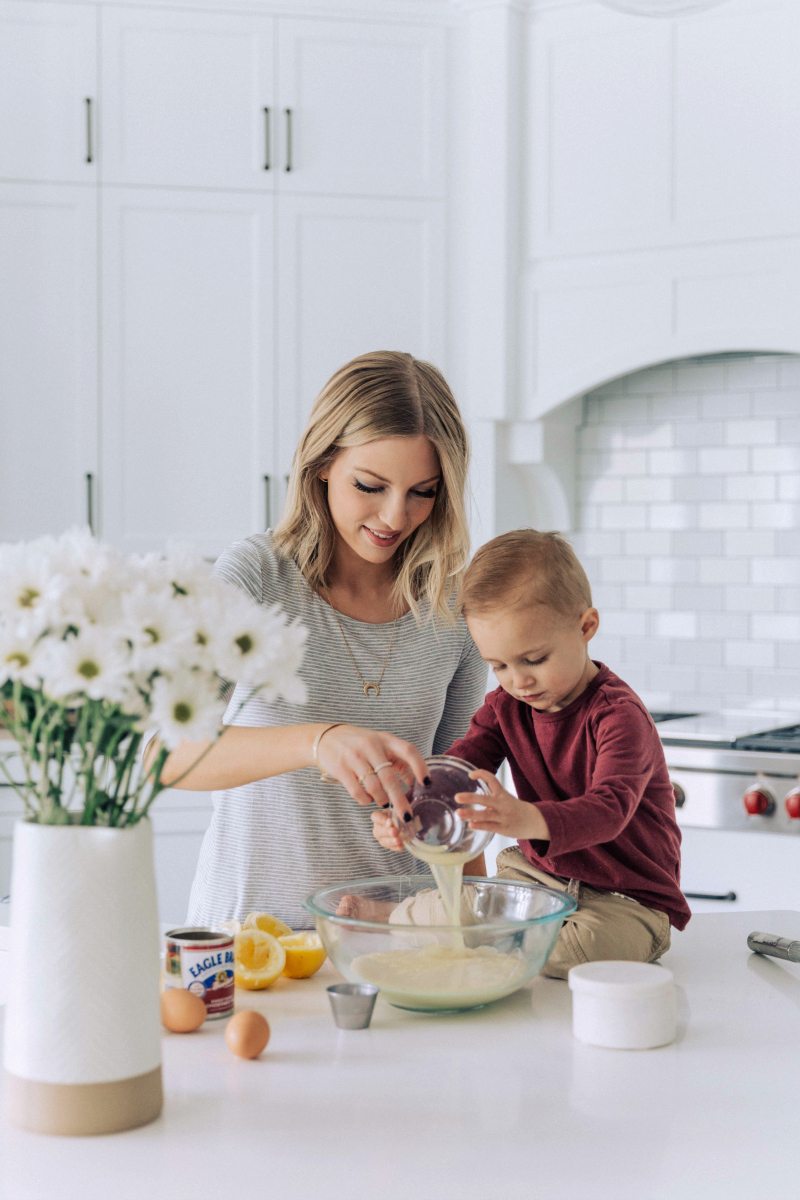 Image of Chelsea and her son making the pie