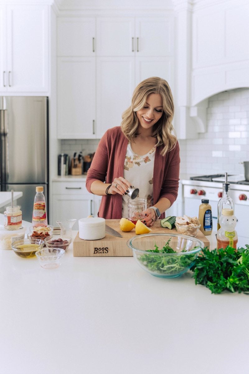 Image of Chelsea making the dressing for this salad.