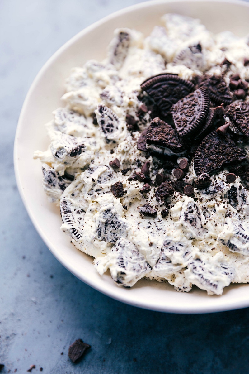 Overhead image of dip with fresh Oreos sprinkled on top ready to be eaten.