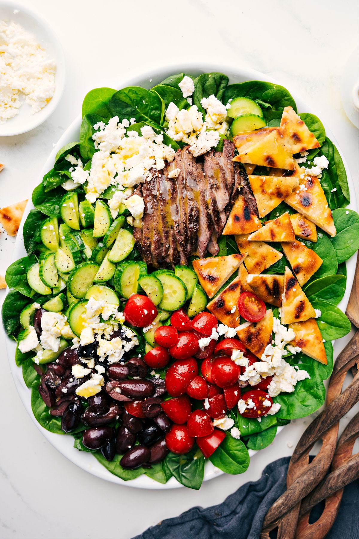 Flavorful And Fresh Grilled Steak Salad Recipe Grilled Steak Salad Recipe served over spinach and drizzled with honey-lemon dressing.