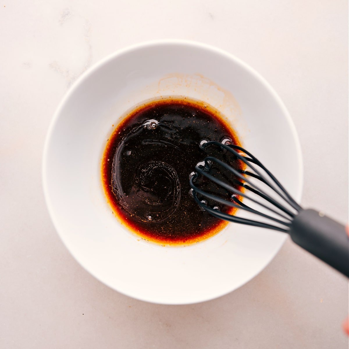 Whisking the sauce for this ground turkey stir fry.
