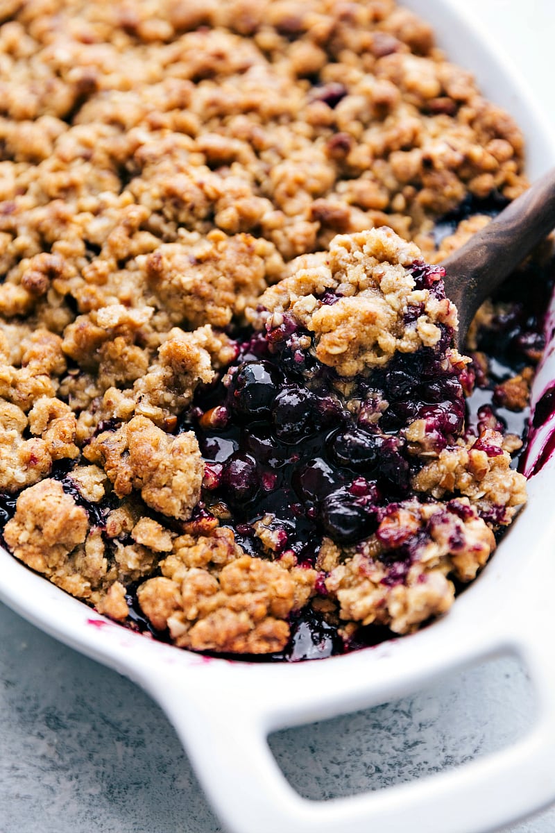 Up-close image of the dessert fresh out of the oven with a spoonful being taken out.