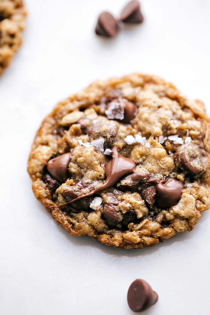 Up close photo of one oatmeal chocolate chip cookie -- soft, chewy, and buttery! With chocolate chips