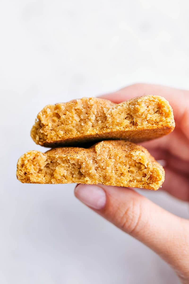 Close-up shot of a Pumpkin Snickerdoodle broken in half to see the soft and chewy interior.