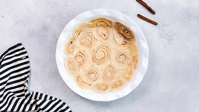 Overhead image of the cinnamon roll crust being made