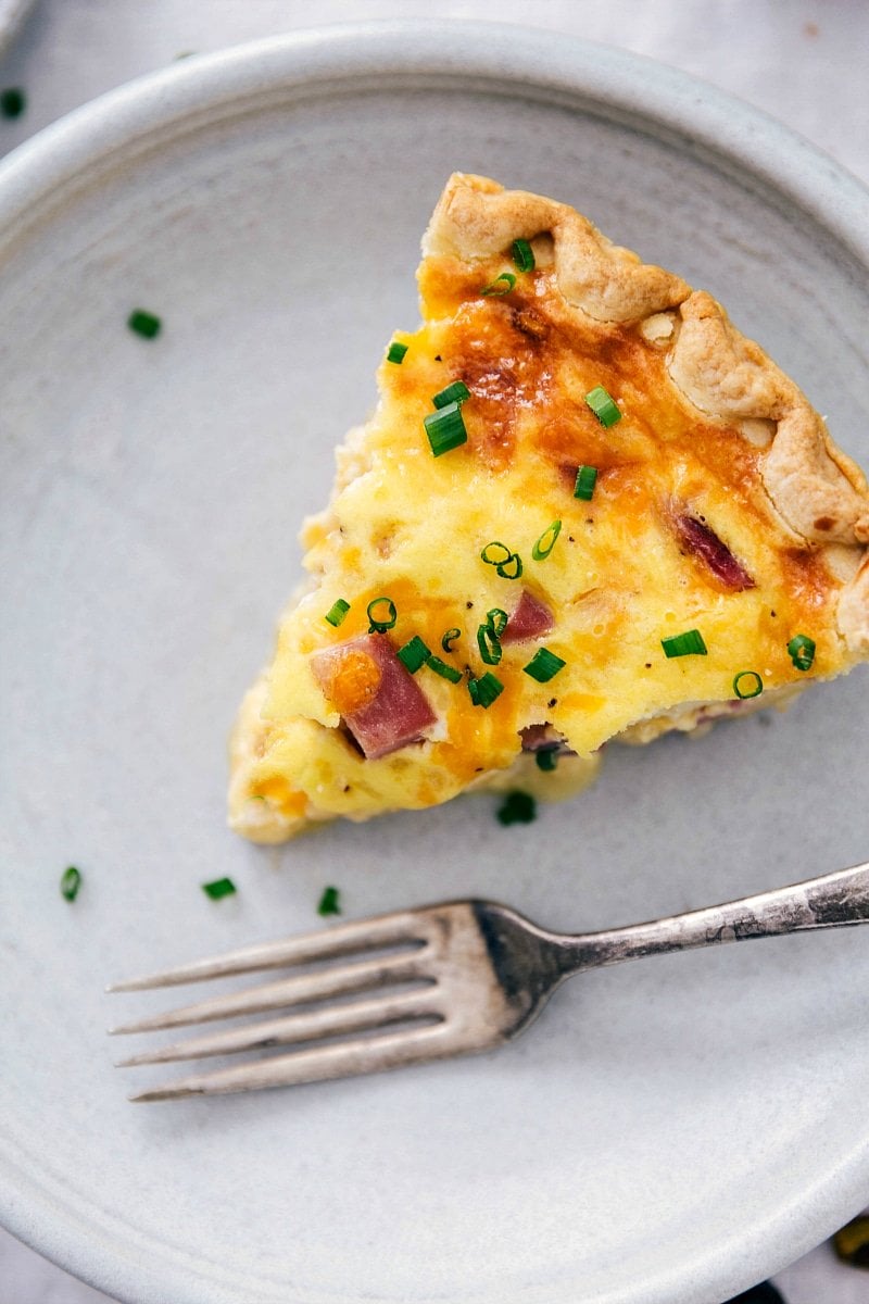 Slice of scrumptious ham and cheese quiche.