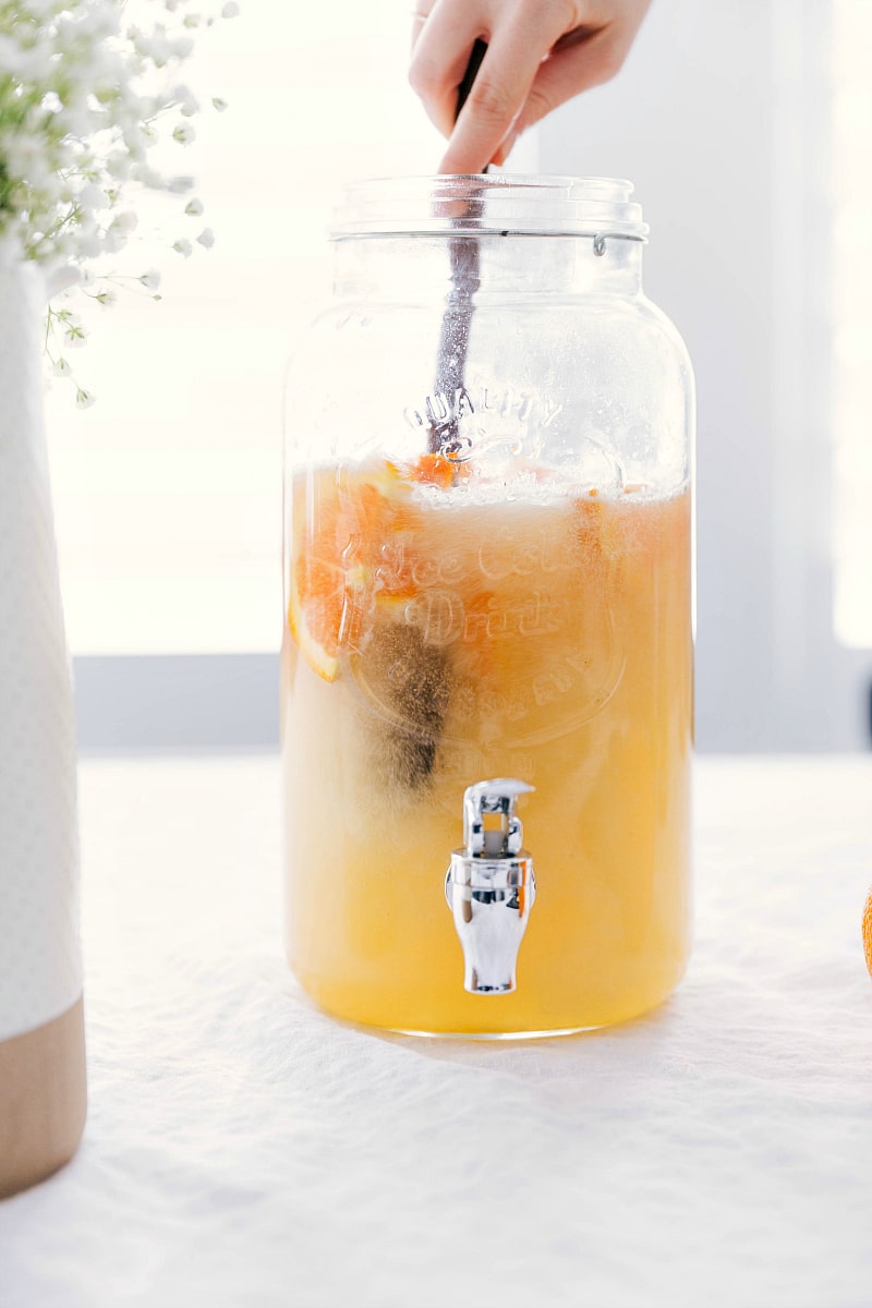 Refreshing and delicious drink being stirred in the serving canister.